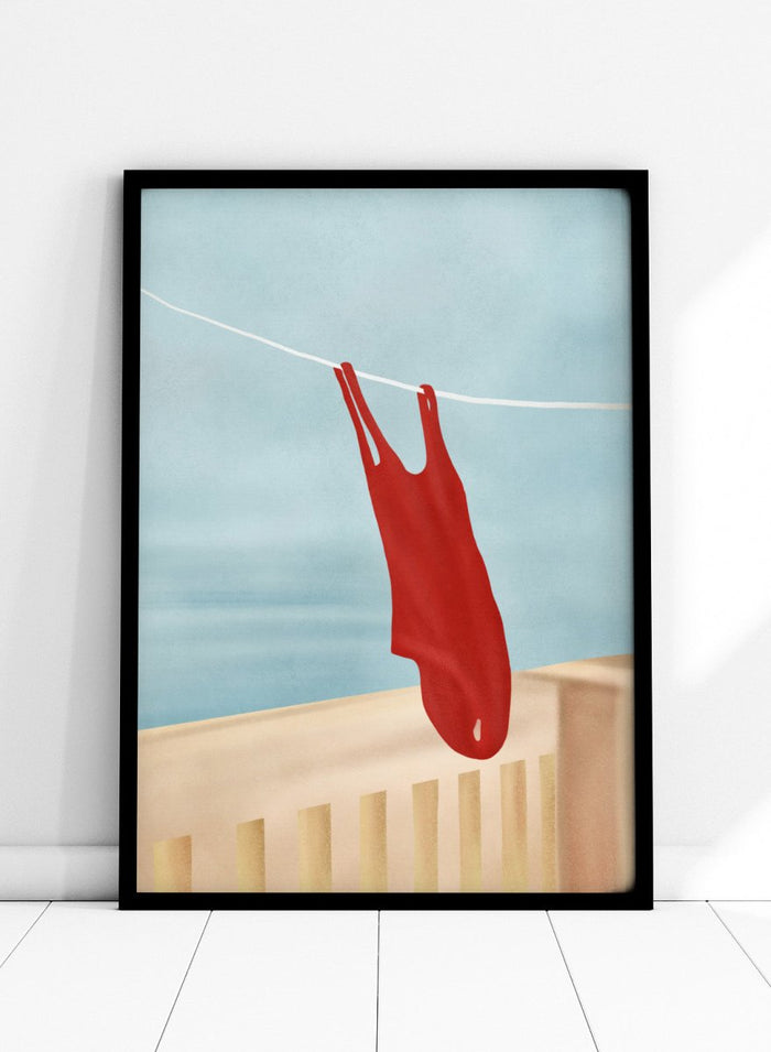 Red swimsuit hanging on a clothesline against a blue sky. Red Swimsuit On Balcony by Flow Line features a red swimsuit drying in the sun, bringing Mediterranean charm and summer vacation style to your walls.