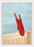 Red swimsuit hanging on a clothesline against a blue sky. Red Swimsuit On Balcony by Flow Line features a red swimsuit drying in the sun, bringing Mediterranean charm and summer vacation style to your walls.