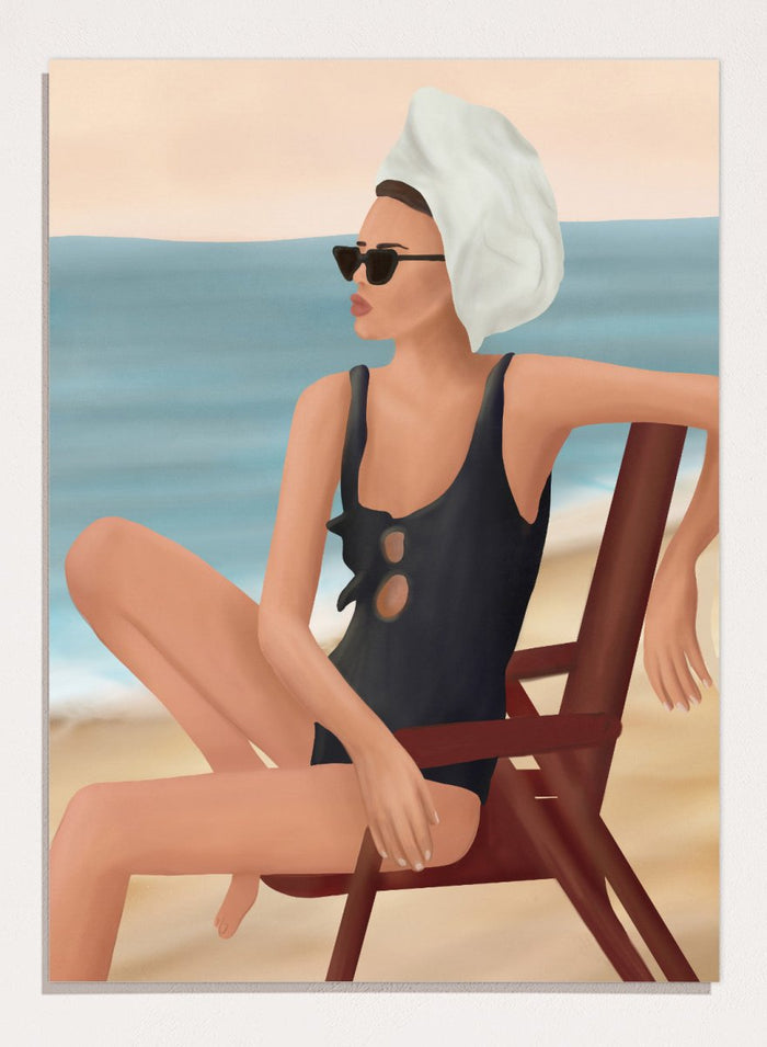 Woman in a black swimsuit with a towel on her head, sitting on a beach chair by the ocean. Relaxed Beach Style by Flow Line features a woman lounging by the sea in vintage swimwear, bringing coastal elegance and summer style to your walls.