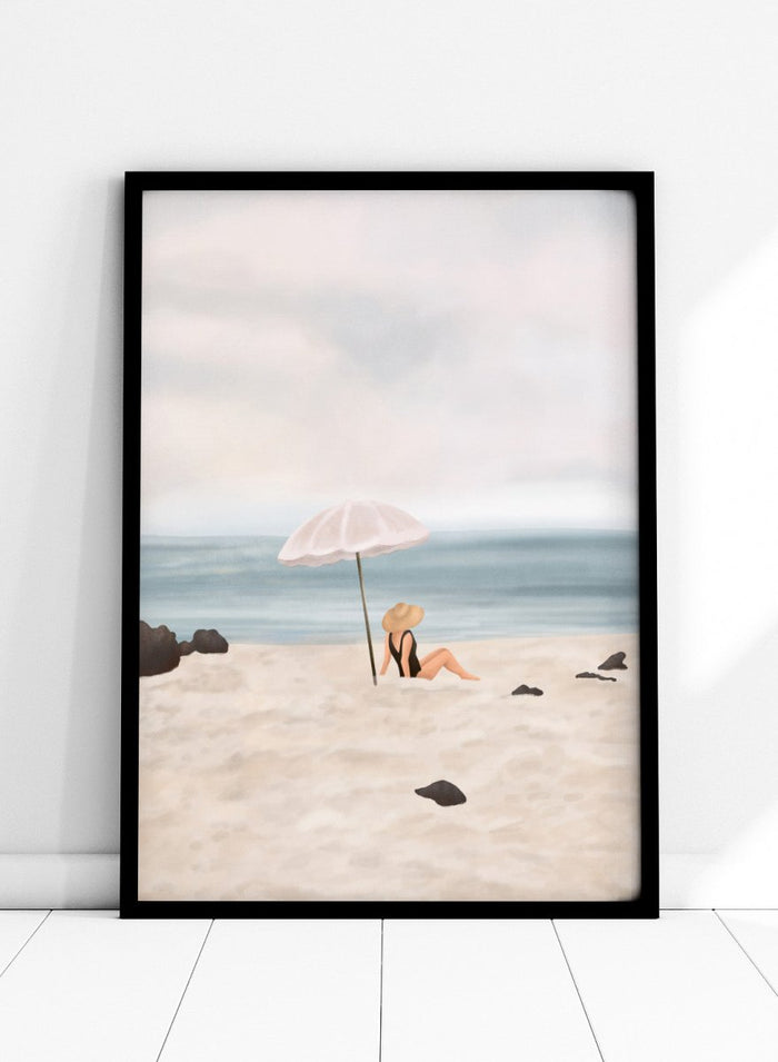 Woman under an umbrella on a beach with a calm ocean and sky. Serene Beach Scene by Flow Line is a coastal art print featuring a woman by the ocean, beach umbrella, seaside illustration, and summer wall art.