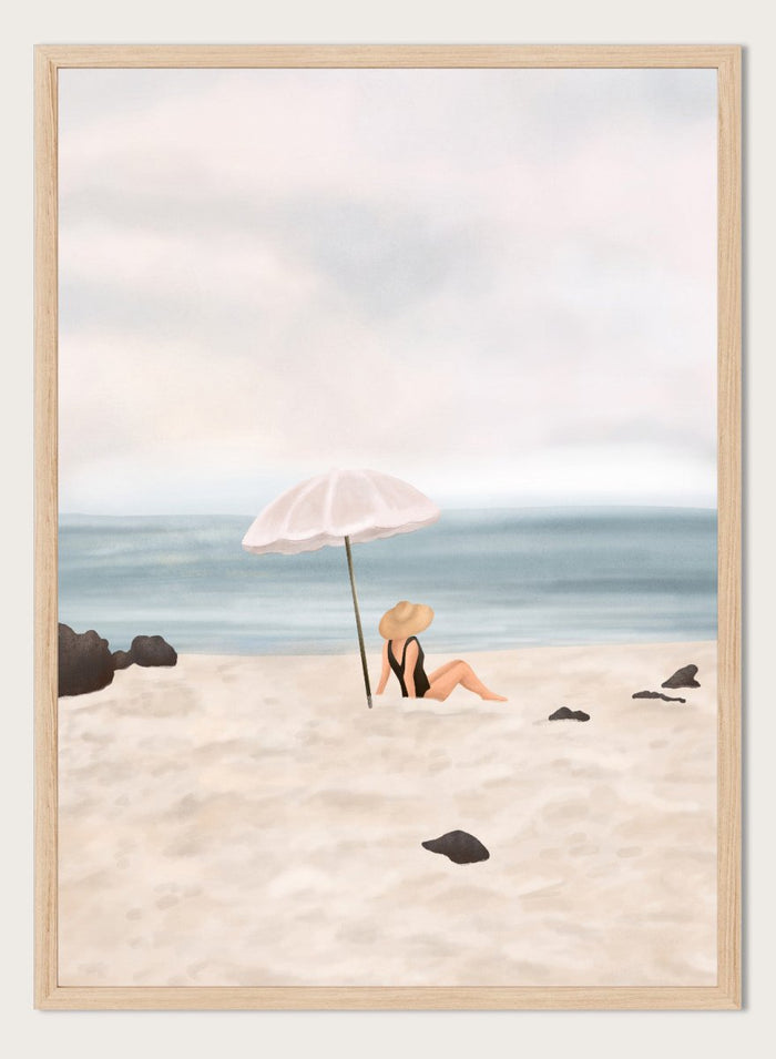 Woman under an umbrella on a beach with a calm ocean and sky. Serene Beach Scene by Flow Line is a coastal art print featuring a woman by the ocean, beach umbrella, seaside illustration, and summer wall art.