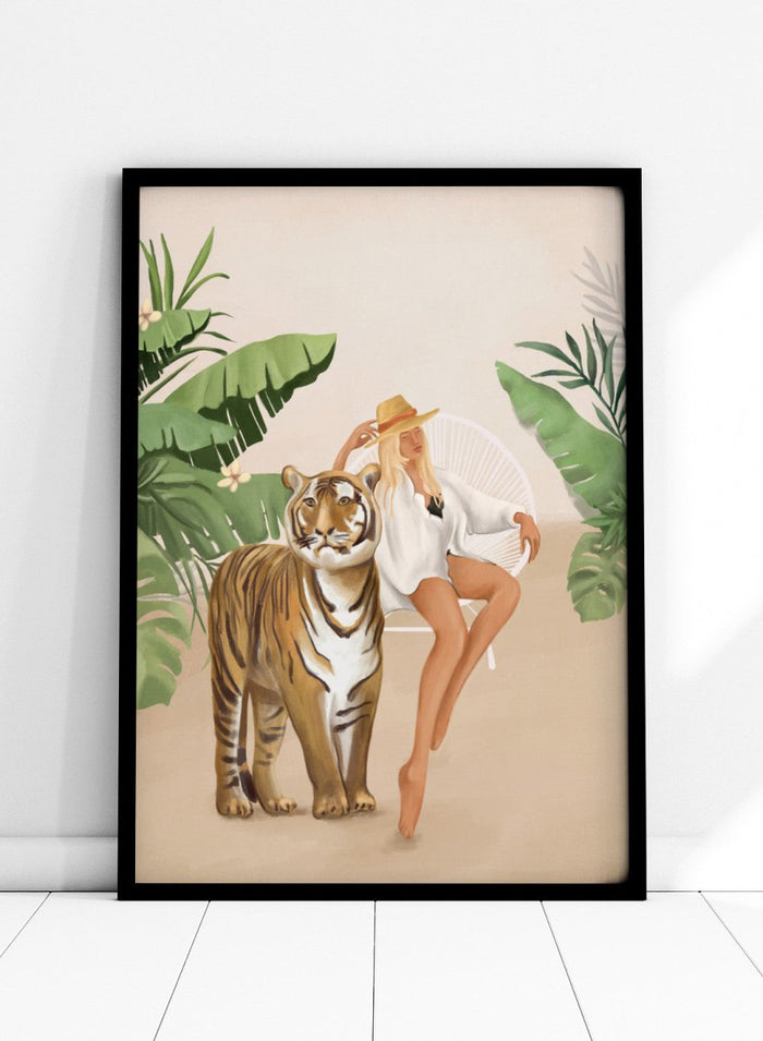 Illustration of a woman sitting next to a tiger with tropical plants in the background. Tropical Tiger Woman by Flow Line is a tropical art print featuring a woman, tiger, and lush greenery, perfect for boho, maximalist, and modern interiors.