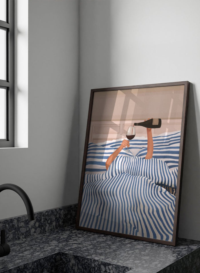 Person lying in bed pouring wine into a glass, wearing striped sheets. Wine In Bed by Flow Line is a playful art print featuring striped bedding, red wine, minimalist illustration, and cozy bedroom decor.