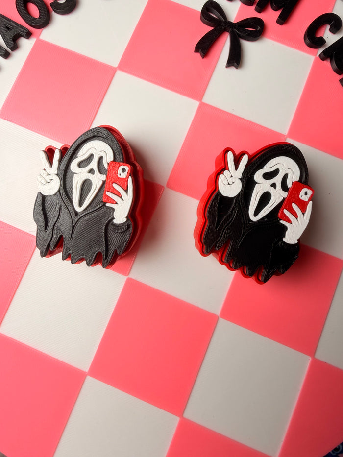 Ghost face peace sign clicker