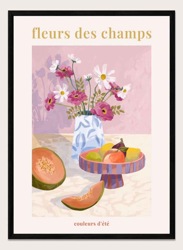 Illustration of a vase with flowers and fruits on a table against a pink background, with text 'fleurs des champs' and 'couleurs d'ete'. Fleur Des Champs Pink by Goed Blauw is a colorful still life art print and wall poster featuring flowers, fruit, and a patterned vase in a modern composition.