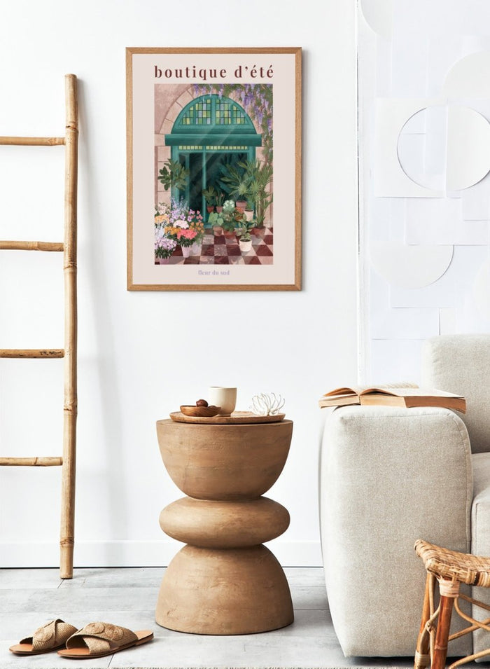 Illustration of a charming store entrance with plants and flowers, featuring the text 'boutique d'été' and 'fleur du sud'. French Flower Shop by Goed Blauw is a colorful storefront art print and wall poster featuring plants, flowers, and a green arch window in a warm European style setting.