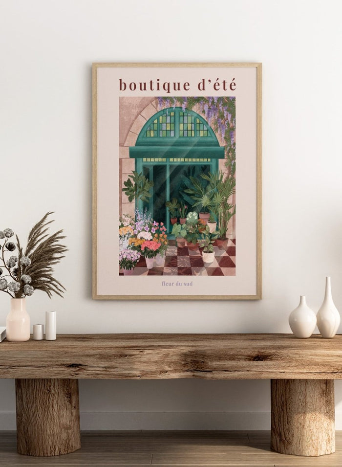 Illustration of a charming store entrance with plants and flowers, featuring the text 'boutique d'été' and 'fleur du sud'. French Flower Shop by Goed Blauw is a colorful storefront art print and wall poster featuring plants, flowers, and a green arch window in a warm European style setting.