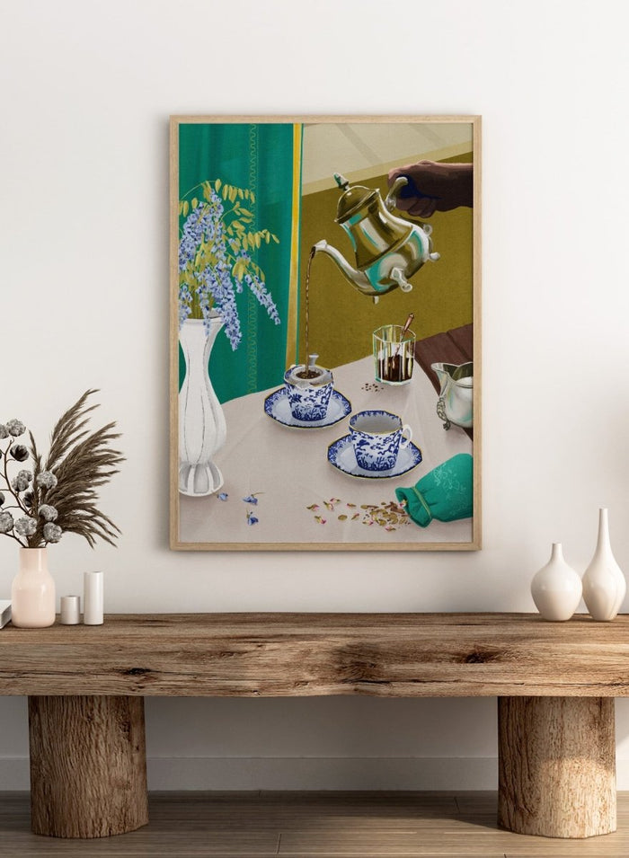 Tea being poured from a teapot into a cup on a table with a vase of flowers and a glass. I Despise English Tea by Goed Blauw is a still life art print and wall poster featuring tea being poured into patterned cups with bold green and gold tones.