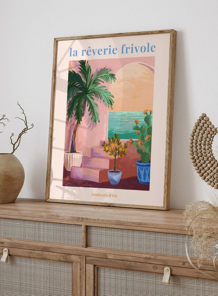 Artistic depiction of a tropical scene with palm trees and plants, featuring the text 'la rçverie frivole'. La Rêverie Frivole Palm by Goed Blauw is a coastal art print and wall poster featuring a palm tree, citrus plant, and ocean view in warm summer tones.