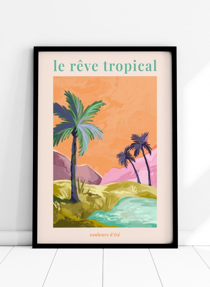 Tropical landscape with palm trees and a lake, featuring the text 'le rève tropical' on an orange background. Le Rêve Tropical Palm Trees by Goed Blauw is a tropical landscape art print and wall poster featuring palm trees, hills, and water in warm sunset tones.