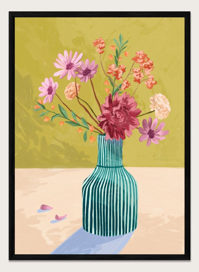 Vase with flowers on a table against a green background. Wildflowers by Goed Blauw is a colorful floral art print and wall poster featuring a striped vase with loose flowers on a warm yellow background.