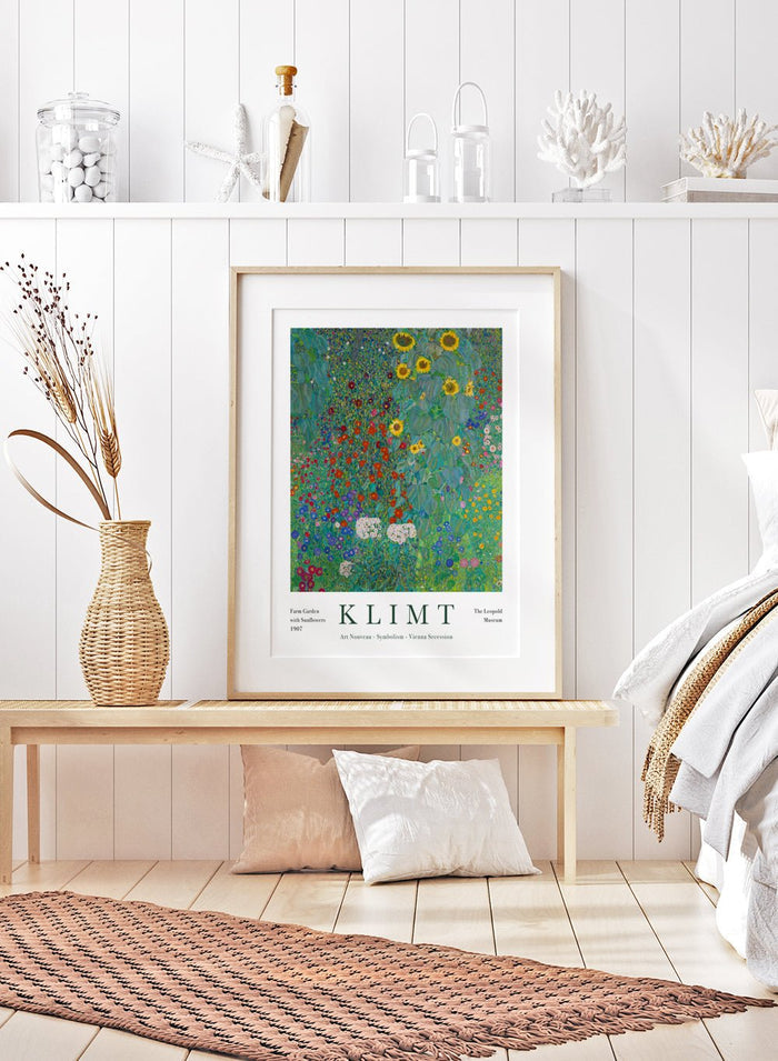 Farm Garden with Sunflowers by Gustav Klimt is a fine art print that feels like standing in the middle of a real country garden in full bloom. Tall sunflowers rise up on one side, while layers of tiny red, blue, pink, and white flowers fill the whole frame, right up to the edges. Klimt painted this from a farmhouse garden near Lake Attersee, and you can feel that lived-in, summer-garden energy in every bit of it. This is the kind of artwork that gives you a tiny escape every time you look at it, especially