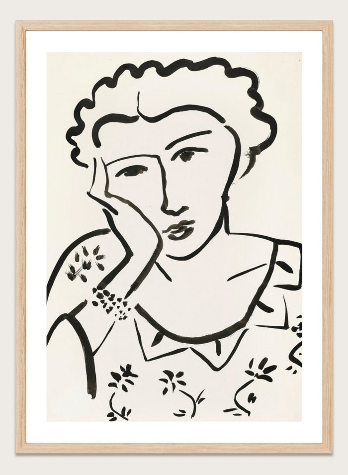 Black line art of a woman with floral patterns on a white background. Jeune Fille Accoudée by Henri Matisse is a minimalist portrait art print featuring expressive black linework, floral detailing, and refined French modernist design.