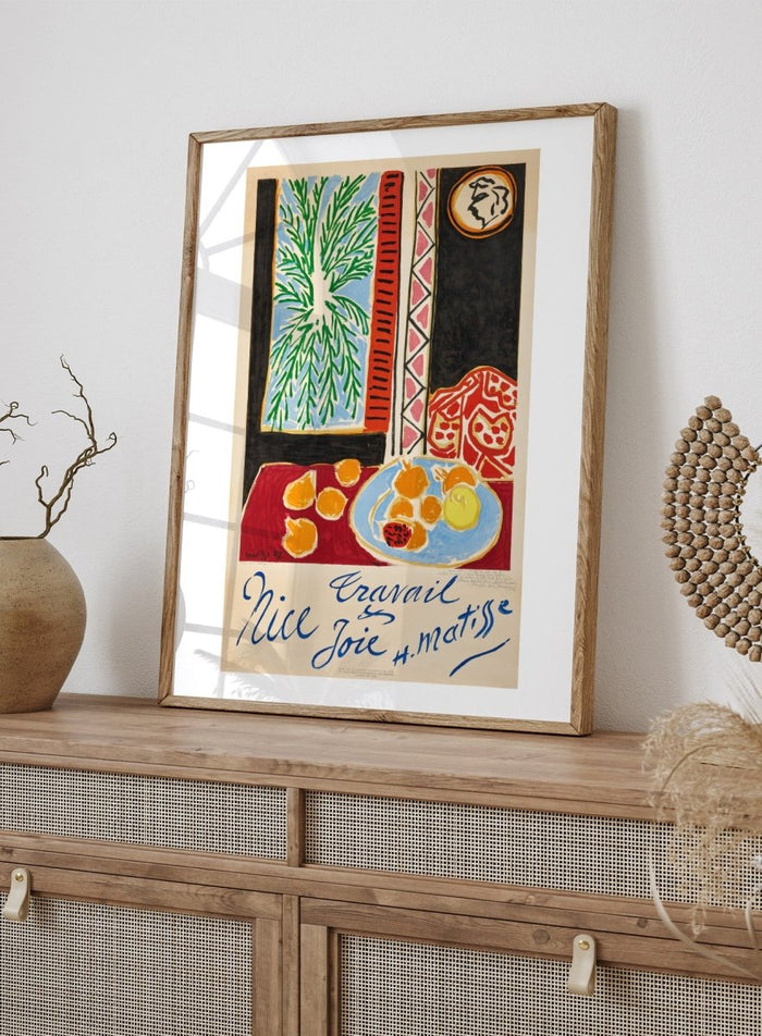 Colorful artwork with a table setting, oranges, and abstract elements on a beige background. Nice, Travail et Joie by Henri Matisse is a colorful 1947 art print featuring Mediterranean interiors, expressive linework, fruit still life details, and modern French design.
