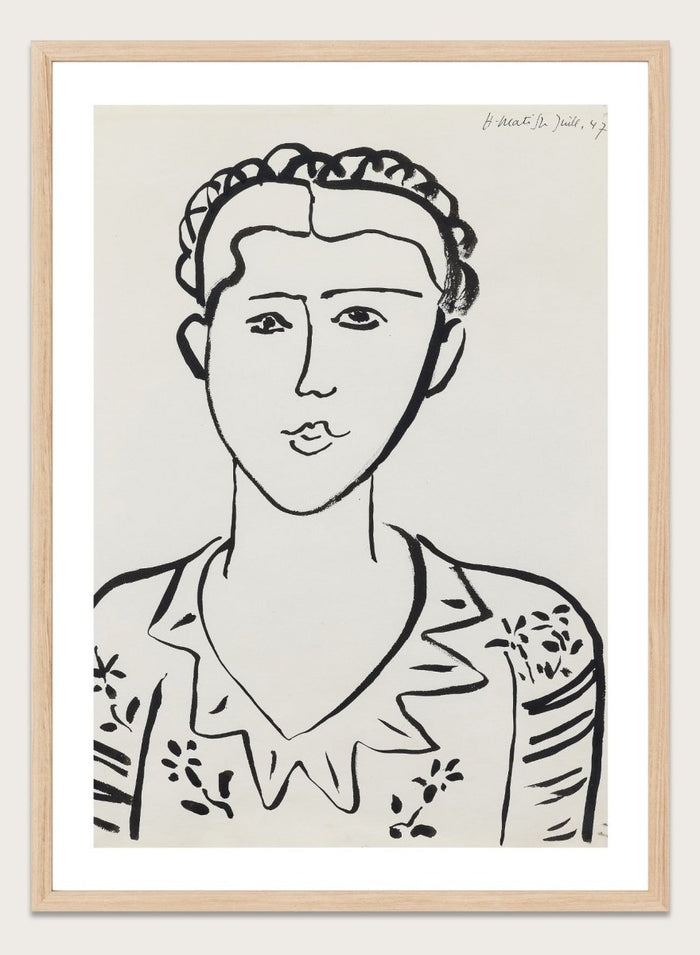 Black line drawing of a woman's portrait on a white background. Portrait de femme by Henri Matisse is a minimalist portrait art print featuring expressive black linework, modern French design, and iconic mid century style.