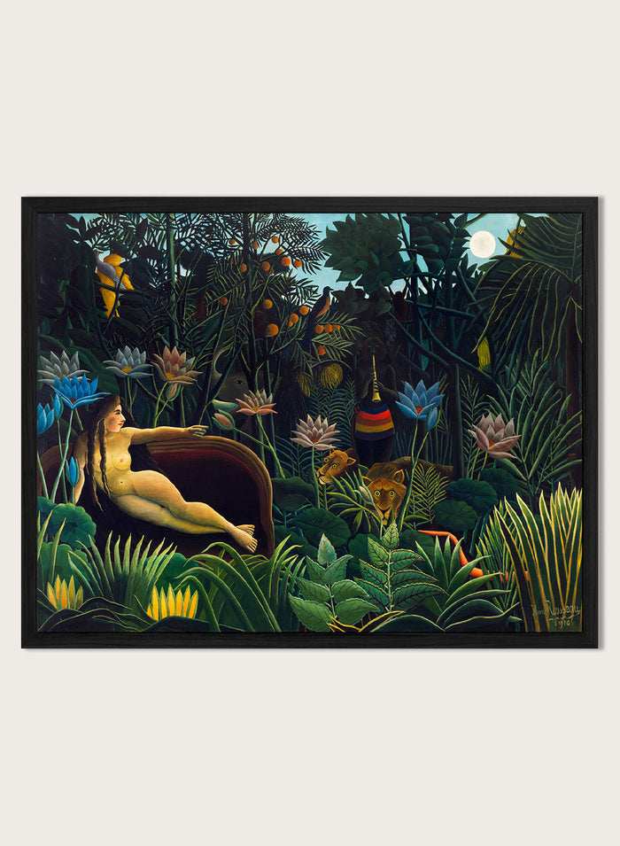 A framed art print depicting a lush, surreal jungle scene with a reclining nude woman in a boat, colorful flowers, birds, and animals under a full moon. The Dream by Henri Rousseau is a vintage jungle art print featuring a reclining woman, lush tropical plants, lions, flowers, and a moonlit forest.