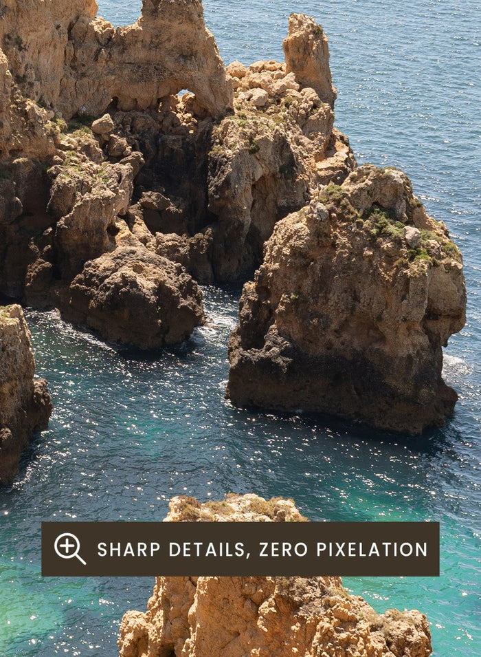 Rocky coastline with clear blue water. Golden Cliffs Azure Ocean by Henrike Schenk is a coastal photography print of rocky sea cliffs overlooking turquoise water and the Mediterranean coastline.