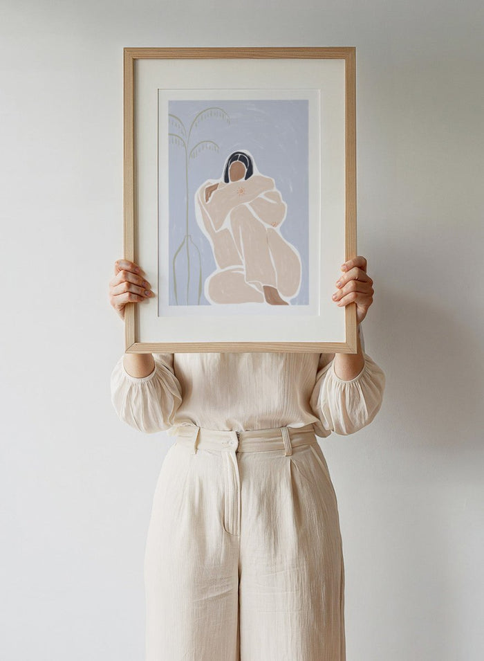 Cuddling Myself by Ivy Green is a modern female figure art print about self-care and comfort. Premium fine art print with optional wood framing.