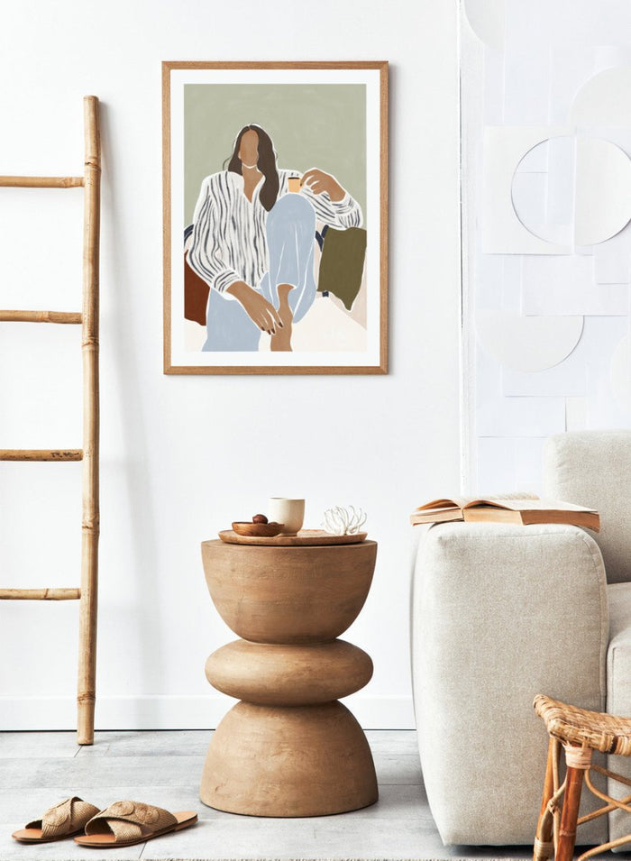 Enjoying a Cup of Espresso by Ivy Green is a modern illustration art print featuring a relaxed woman with coffee. Premium fine art print with optional wood framing.