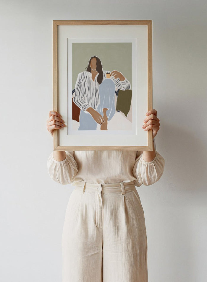 Enjoying a Cup of Espresso by Ivy Green is a modern illustration art print featuring a relaxed woman with coffee. Premium fine art print with optional wood framing.