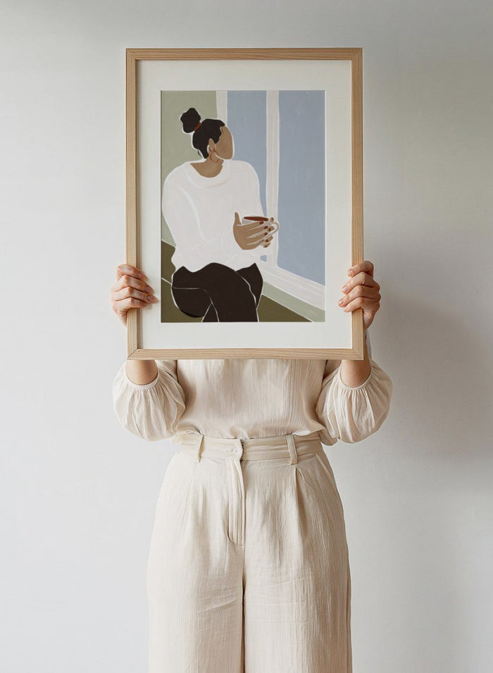 Enjoying a Cup of Tea by Ivy Green is a calm modern figure art print celebrating slow moments and everyday rituals. Premium fine art print with optional wood framing.