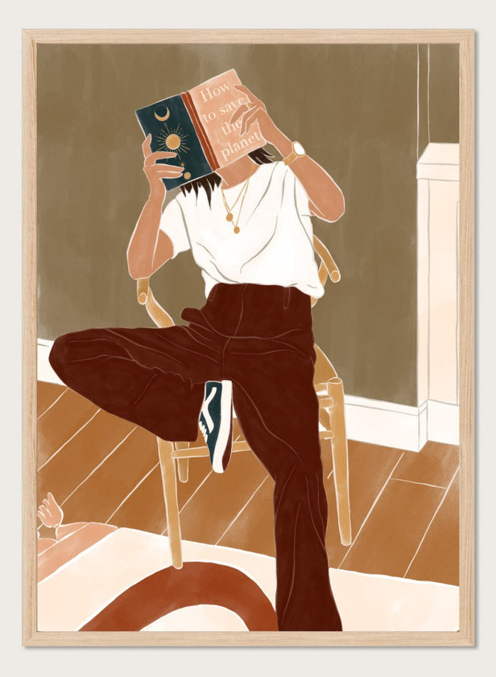 How To Save the Planet by Ivy Green is a modern lifestyle art print featuring a woman reading in a cozy interior. Premium fine art print with optional wood framing.