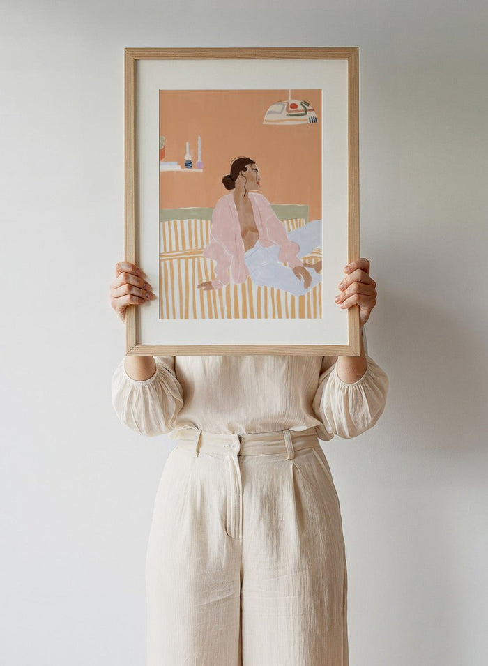 Just Let Me Chill by Ivy Green is a modern lifestyle art print featuring a relaxed woman on a sofa in warm tones. Premium fine art print with optional wood framing.