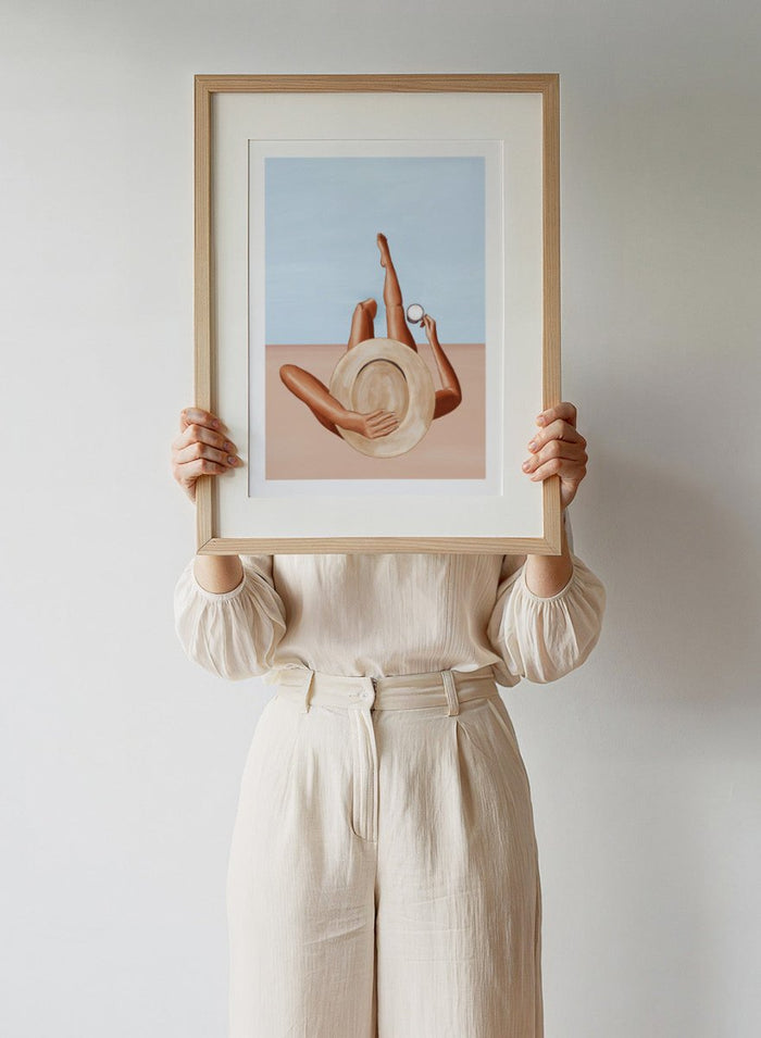 Poolside Girl by Ivy Green is a modern illustration art print featuring a woman relaxing poolside in the sun. Premium fine art print with optional wood framing.