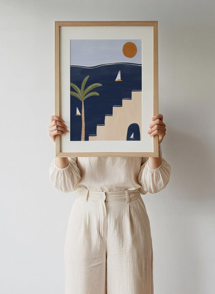 Sailboats by Ivy Green is a modern coastal art print featuring sailboats on deep blue water with palm trees and sun. Premium fine art print with optional wood framing.