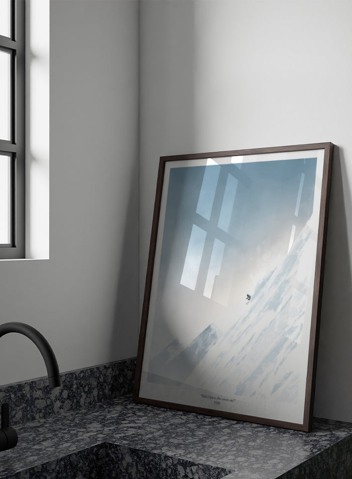 A framed art print featuring a minimalist illustration of a skier on a snowy mountain slope under a pale blue sky, with the text 'Did I leave the oven on?' at the bottom. Shop Extreme Mountain Skiing by Jake Waldron, a minimalist ski wall art print featuring alpine mountains, extreme skiing, and soft blue winter tones.