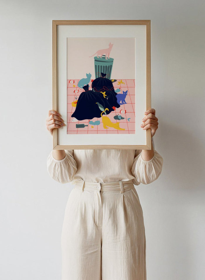 Illustration of a trash can and cats on a pink grid background. Cats by Jota de Jai is a funny modern wall art print featuring colorful cats taking over a messy room. Officially licensed fine art poster with optional wood frame.