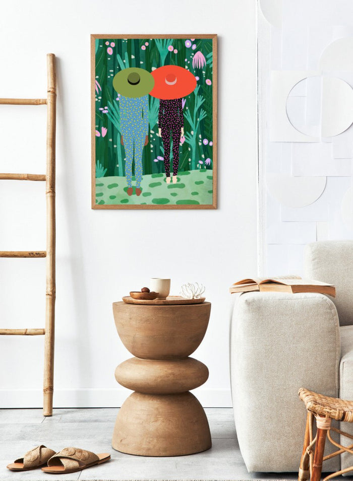 Two people with large hats walking through a lush, colorful forest. Jungle Pajamas by Jota de Jai is an officially licensed fine art wall poster about friendship and quiet connection, available framed or unframed.