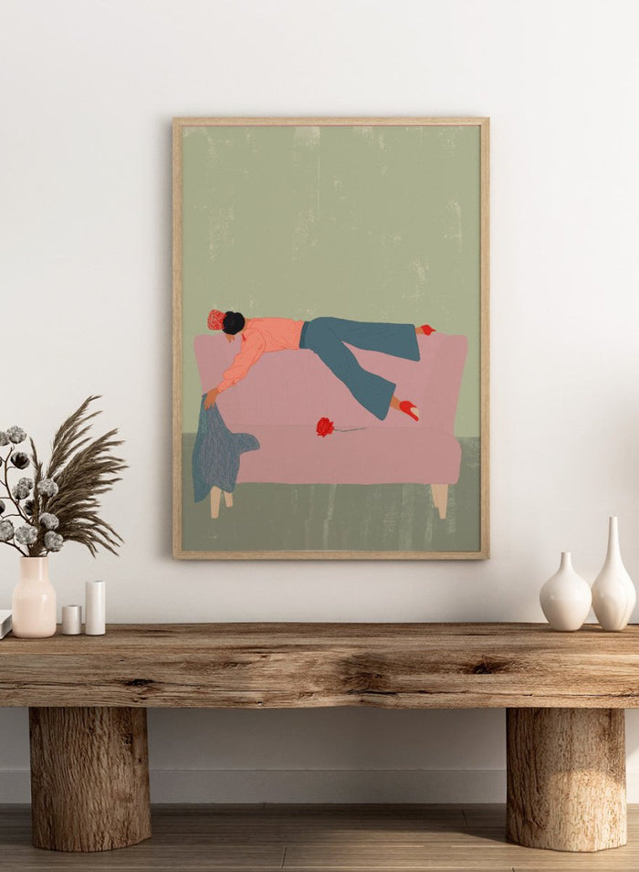 Illustration of a person lying on a pink couch with a red flower, against a green background. Rocío by Jota de Jai is a modern fine art print of a woman draped across a pink sofa with a red rose, officially licensed wall poster available framed in real wood.