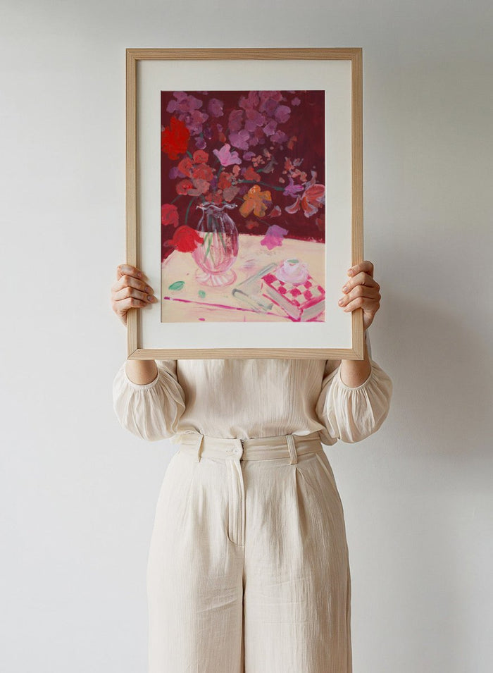 Colorful still life painting with flowers and a teacup on a table. Fall Bouquet by Katharina Puritscher art print featuring expressive floral still life, glass vase, coffee cup, book, and brushstrokes. Officially licensed wall poster.