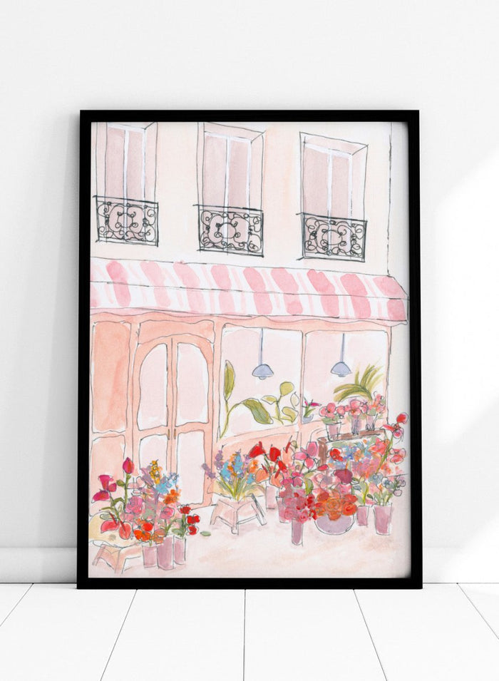 Illustration of a flower shop with a striped awning and flowers in front. Pink Flower Shop by Katharina Puritscher features a Paris-inspired storefront illustration with colorful bouquets, soft watercolor textures, and European street details. Floral art print with optional framing.