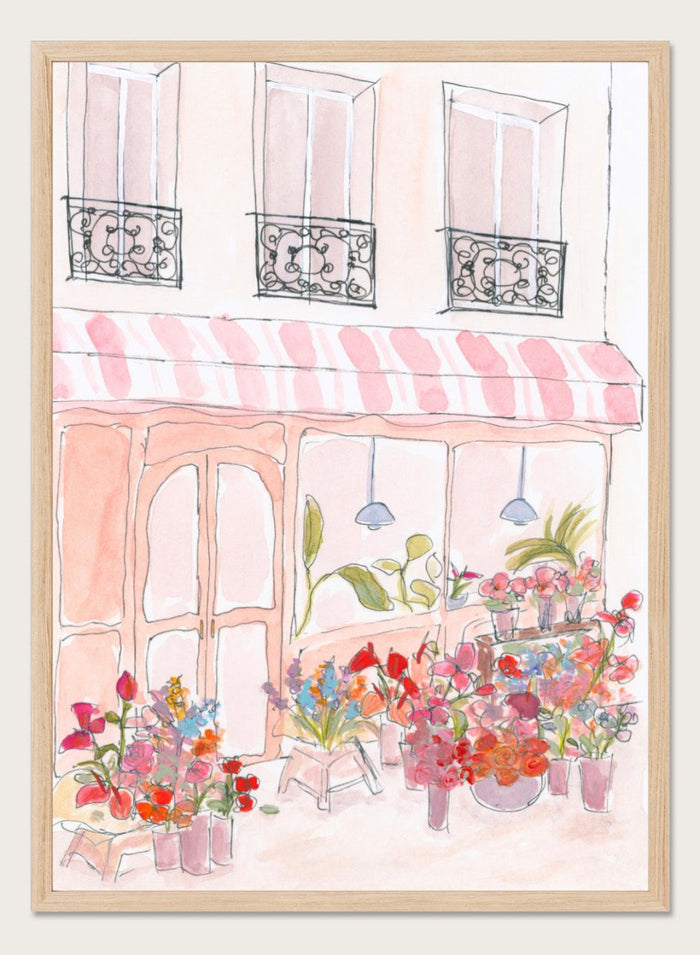 Illustration of a flower shop with a striped awning and flowers in front. Pink Flower Shop by Katharina Puritscher features a Paris-inspired storefront illustration with colorful bouquets, soft watercolor textures, and European street details. Floral art print with optional framing.