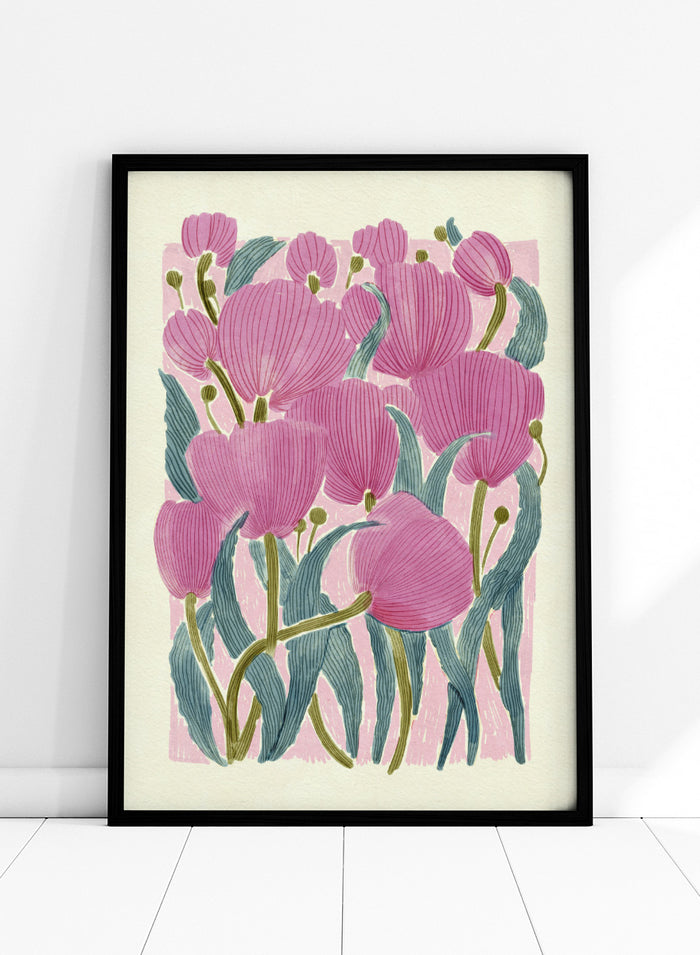 A framed art print featuring a stylized illustration of pink tulips with textured green leaves on a light cream background. Shop Pink Tulips by Katie O'Shea, a botanical floral art print featuring layered pink tulips, blue-green leaves, fine linework, and soft spring color.