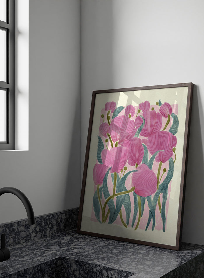 A framed art print featuring a stylized illustration of pink tulips with textured green leaves on a light cream background. Shop Pink Tulips by Katie O'Shea, a botanical floral art print featuring layered pink tulips, blue-green leaves, fine linework, and soft spring color.