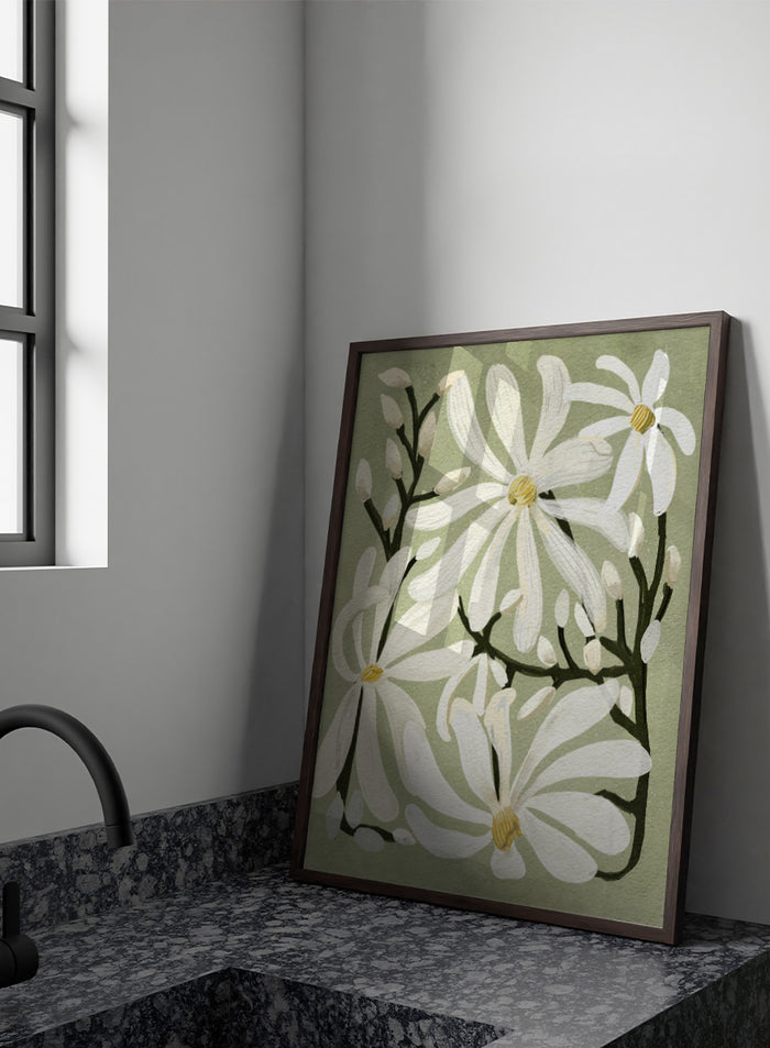 A botanical art print featuring white magnolia flowers with yellow centers and dark green stems on a muted sage green background. Shop Star Magnolia Floral Art Print by Katie O'Shea, a botanical floral art print featuring white magnolia blooms, dark branches, and a soft sage green background.