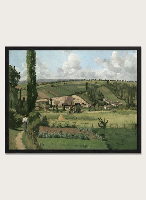 A framed landscape painting depicting a green countryside scene with rolling hills, trees, a path, small buildings, and a cloudy sky. Landscape at Les Pâtis, Pontoise by Camille Pissarro is a vintage French landscape print featuring green fields, farm workers, rolling hills, and a summer sky.