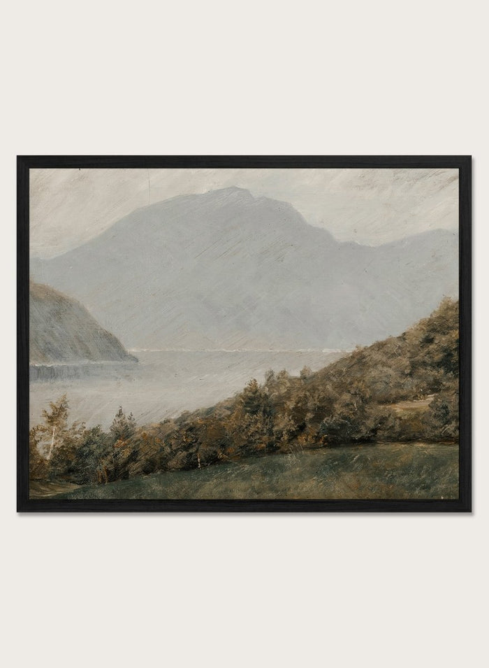 A framed landscape painting depicting a misty mountain range over a body of water with trees in the foreground. Landscape with Mountains in the Background by Susette Holten is a vintage mountain landscape print featuring a lake, misty peaks, trees, and muted natural tones.
