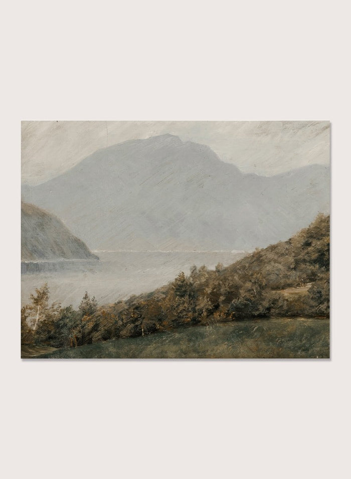 A framed landscape painting depicting a misty mountain range over a body of water with trees in the foreground. Landscape with Mountains in the Background by Susette Holten is a vintage mountain landscape print featuring a lake, misty peaks, trees, and muted natural tones.