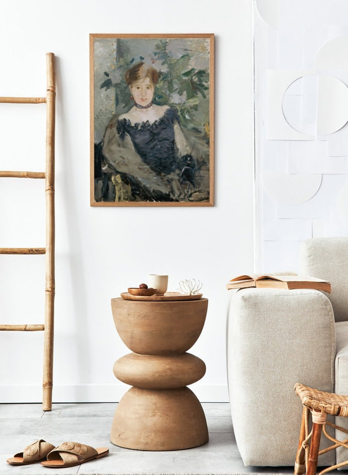 Le Corsage Noir by Berthe Morisot is a vintage Impressionist portrait print of a young woman in a black bodice, red ribbon, and white flowers behind her.