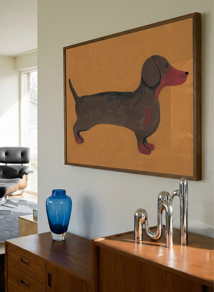 Framed artwork of a dachshund on an orange background. Sweet Dachshund Dog by Lerin Freyou is a modern dachshund art print featuring a minimal dog illustration with orange background, aesthetic animal poster design.