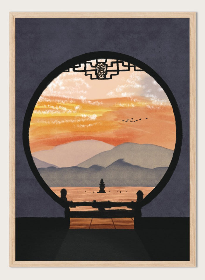 A framed art print depicting a scenic landscape viewed through a circular window frame. The scene shows layered mountains under a warm orange and yellow sunset sky with a small pagoda-like structure and birds, set against a dark gray background. Asian Pagoda Sunset View by Lisa Solomoniuk premium framed fine art print featuring layered mountains, a distant pagoda, and a glowing peach sunset.