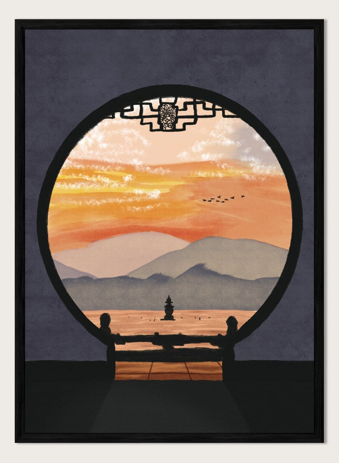 A framed art print depicting a scenic landscape viewed through a circular window frame. The scene shows layered mountains under a warm orange and yellow sunset sky with a small pagoda-like structure and birds, set against a dark gray background. Asian Pagoda Sunset View by Lisa Solomoniuk premium framed fine art print featuring layered mountains, a distant pagoda, and a glowing peach sunset.