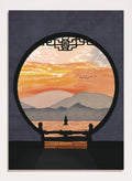 A framed art print depicting a scenic landscape viewed through a circular window frame. The scene shows layered mountains under a warm orange and yellow sunset sky with a small pagoda-like structure and birds, set against a dark gray background. Asian Pagoda Sunset View by Lisa Solomoniuk premium framed fine art print featuring layered mountains, a distant pagoda, and a glowing peach sunset.