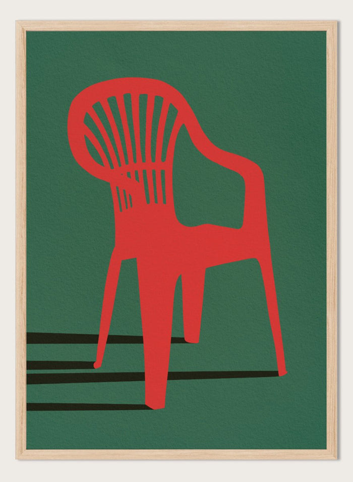 Bold Red Chair by Lisa Solomoniuk premium framed fine art print featuring a vivid red chair, deep green background, and long black shadows.
