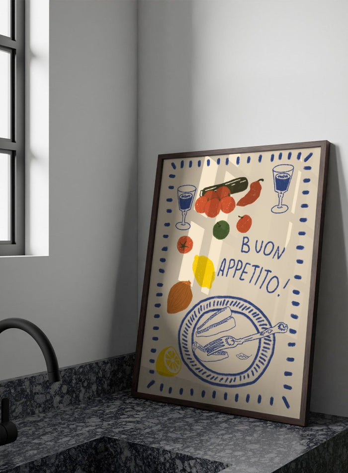 An illustrated print or card with the Italian phrase “BUON APPETITO!” in blue lettering, surrounded by hand-drawn food items including tomatoes, a lemon, an almond, a cucumber, a plate with bread and a fork, and two glasses with blue liquid. Buon Appetito Meal by Lisa Solomoniuk premium framed fine art print featuring a finished meal, wine glasses, fresh ingredients, and playful Italian lettering.
