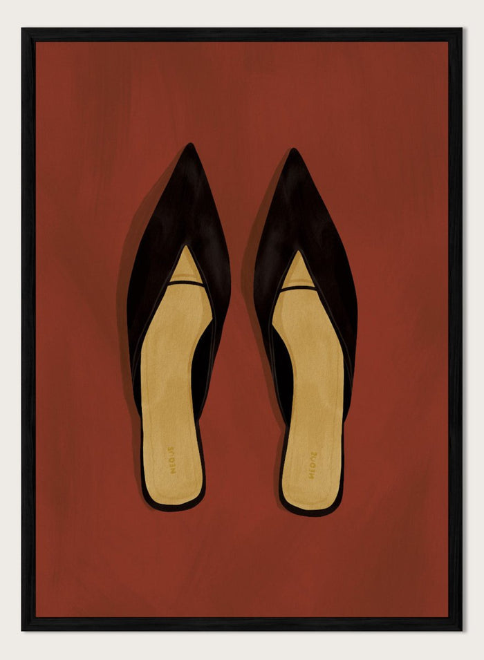 A pair of black pointed-toe flat mules with a contrasting beige insole, displayed flat against a solid reddish-brown background. Chic Black Mules by Lisa Solomoniuk premium framed fine art print featuring pointed black shoes with golden insoles against a rich rust red background.